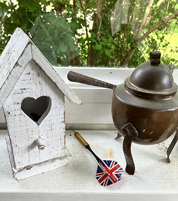 Fågelbo dartpil och kaffepanna