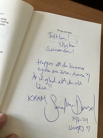 Hälsning och signering av Sanna Mac Donald i boken Ospårat