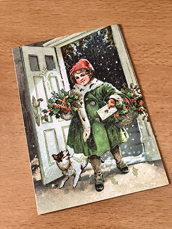 Julkort med julposttjej o hund