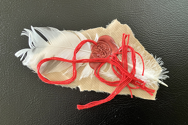 Fjäder med lacksigill