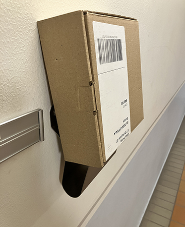 Paket i tidningshållaren